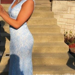 Long, baby blue lace dress with a V cut neck line!